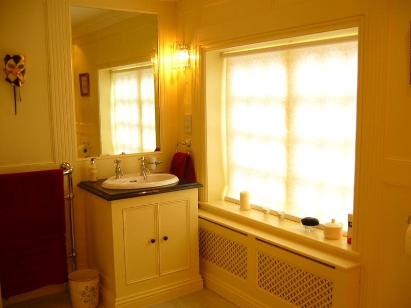 Full Height Paneled Bathroom Showing Vanity Unit And Radiator Cover